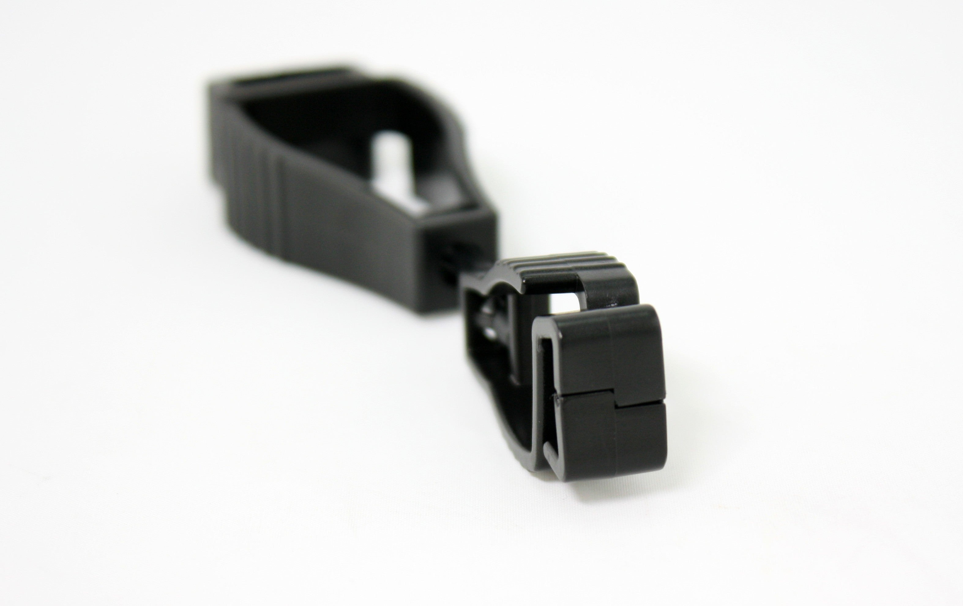 Close up of end clasp of black glove clip