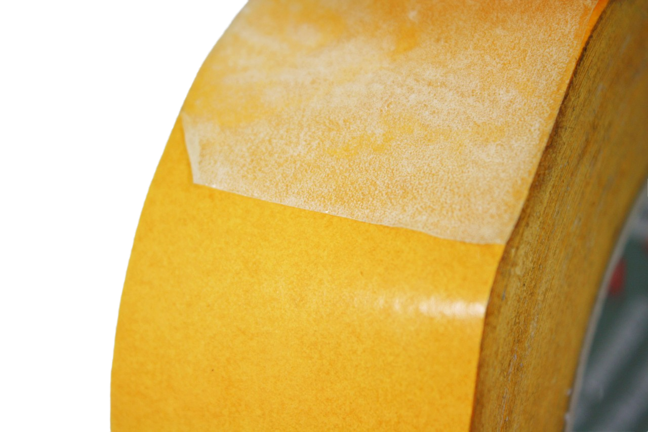 Another close up of the tape on the roll. The protective laminate has been peeled away to show the tape underneath