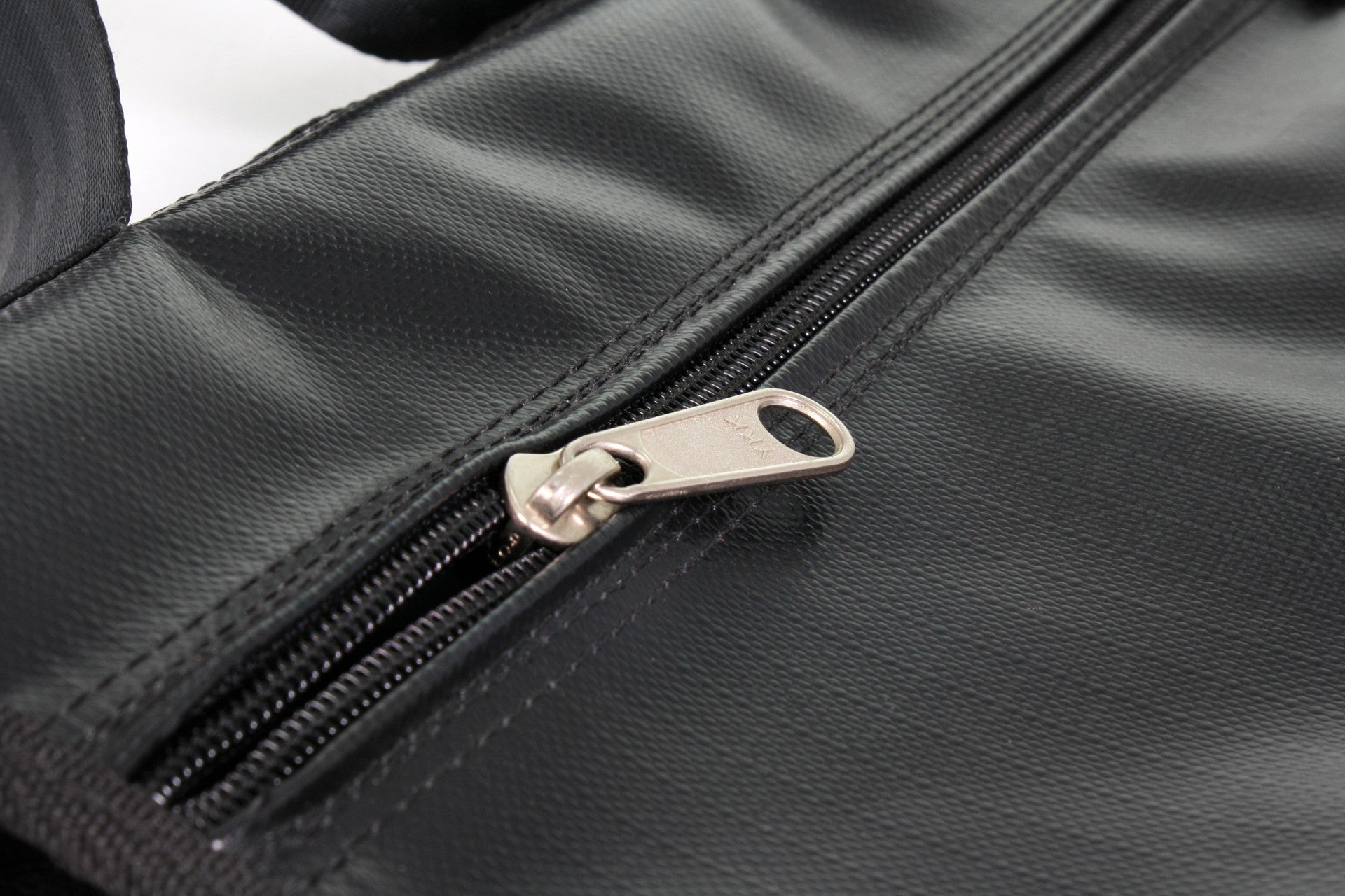 Close up of the YKK zip on the black refillable sandbag