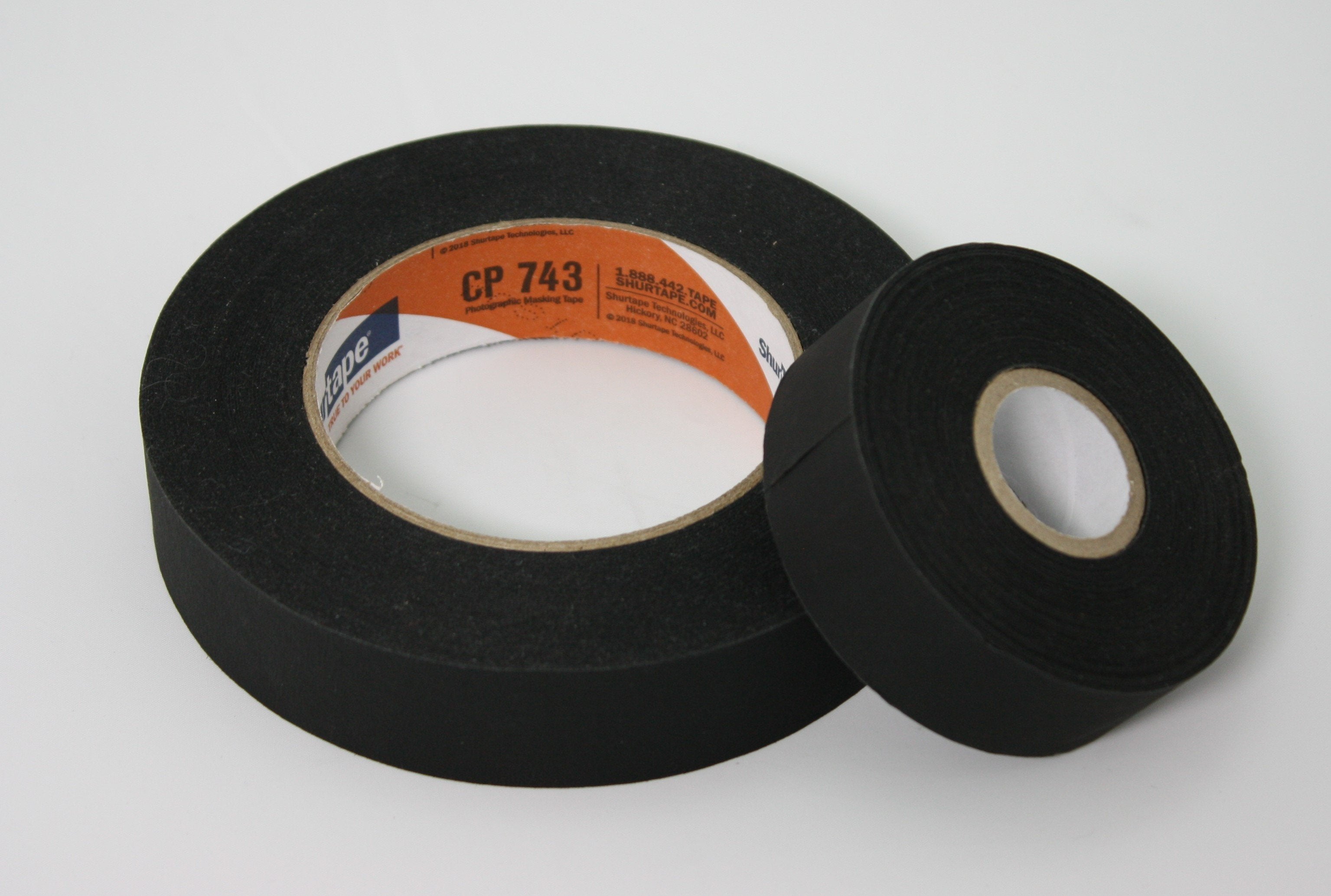 Shurtape CP-743 Matte Photo Tape, 1", small core roll and a 1" normal core roll side by side, lying flat