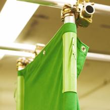 Digital green speed clip in use on a green screen fabric