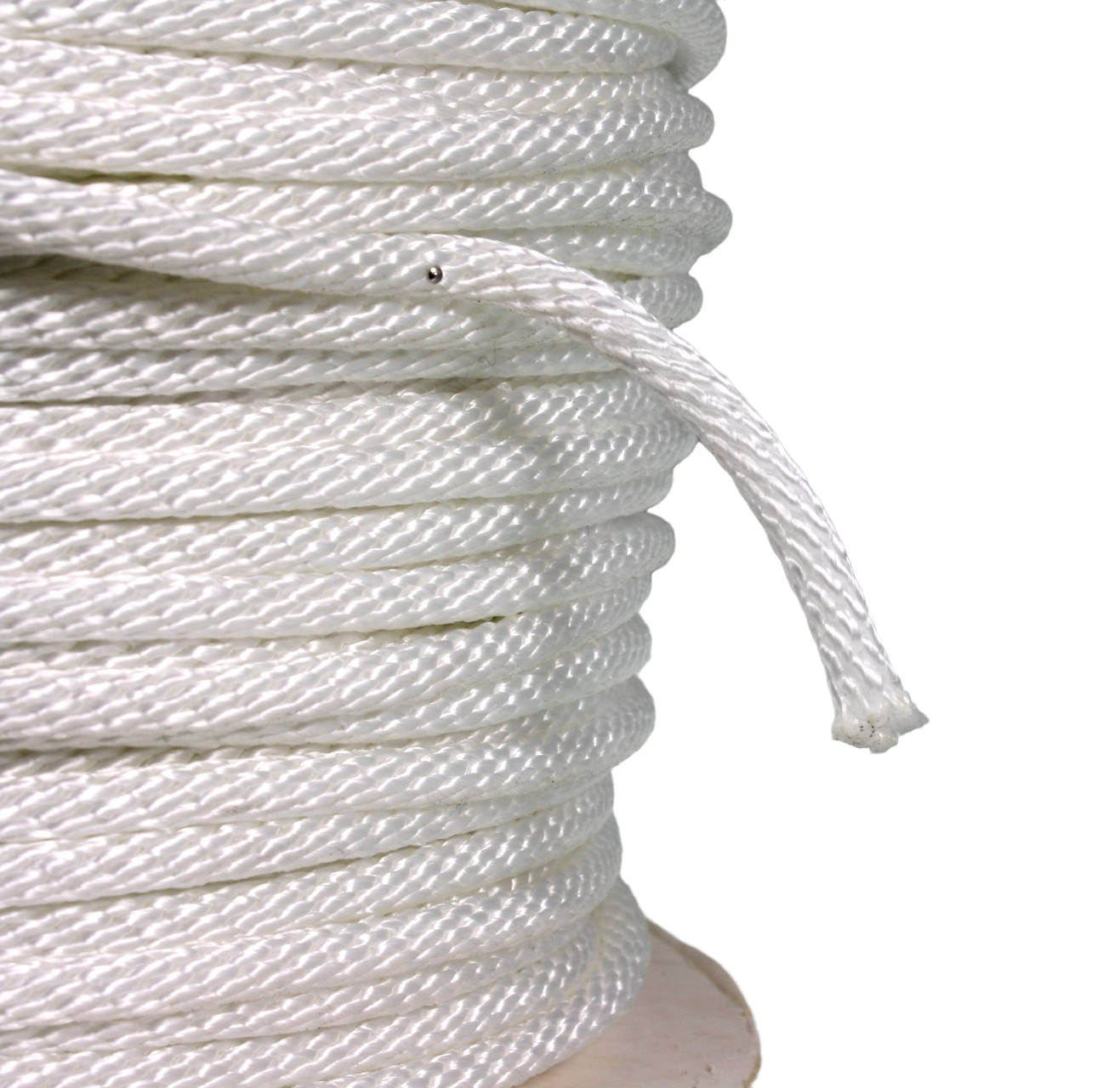 End of a roll of white sash cord, showing that the tail of it has been burned to seal the fibres.