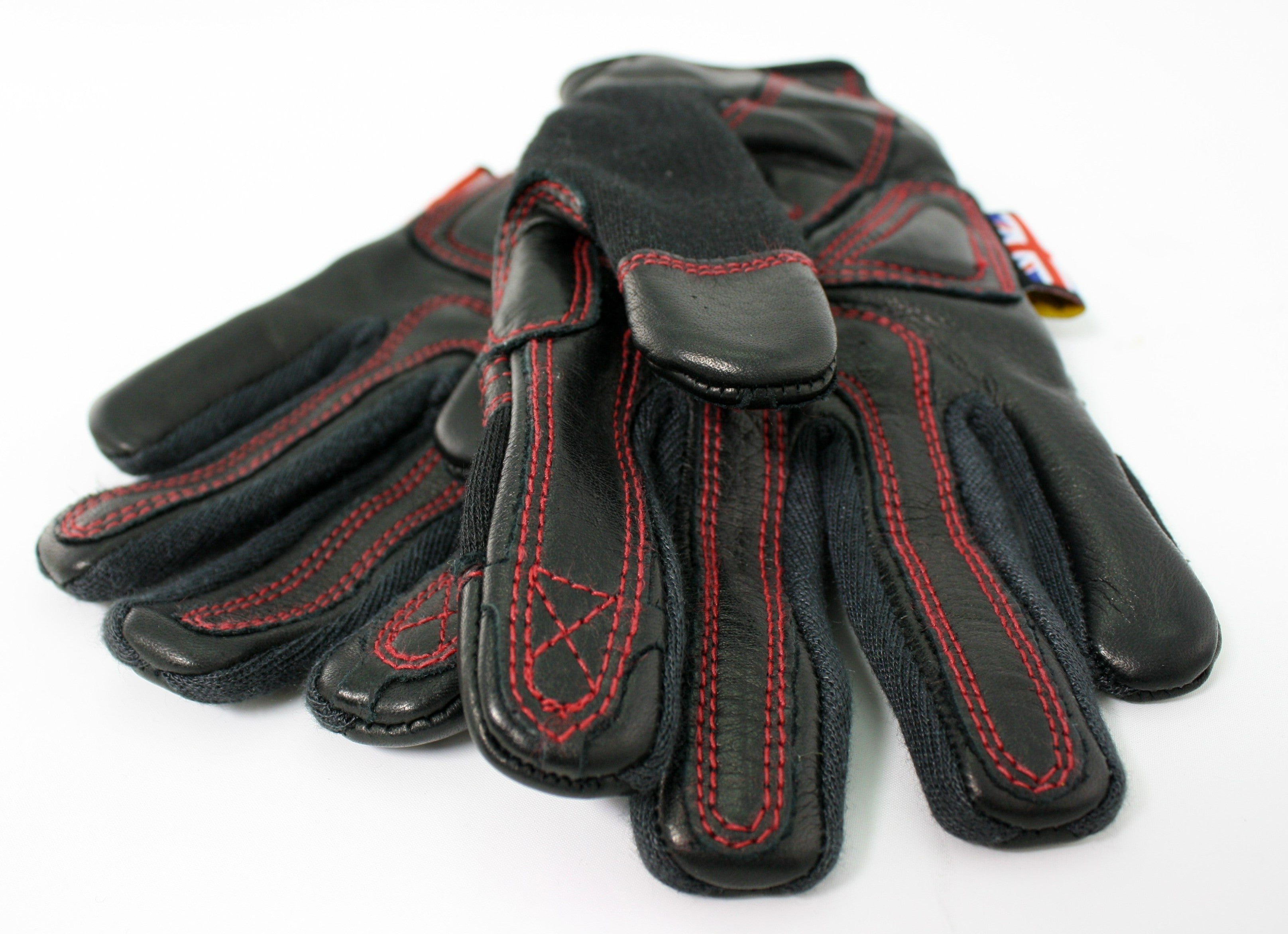 A pair of Phoenix gloves, one on top of the other, both palms up. Close up of the fingertips and stitching.