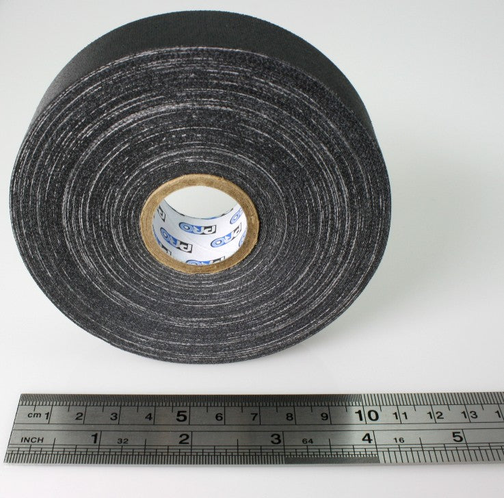 A close up of a 1" roll of Pro Gaff tape, small core, next to a ruler. The image shows that the widest part of the tape roll is just over 11cm