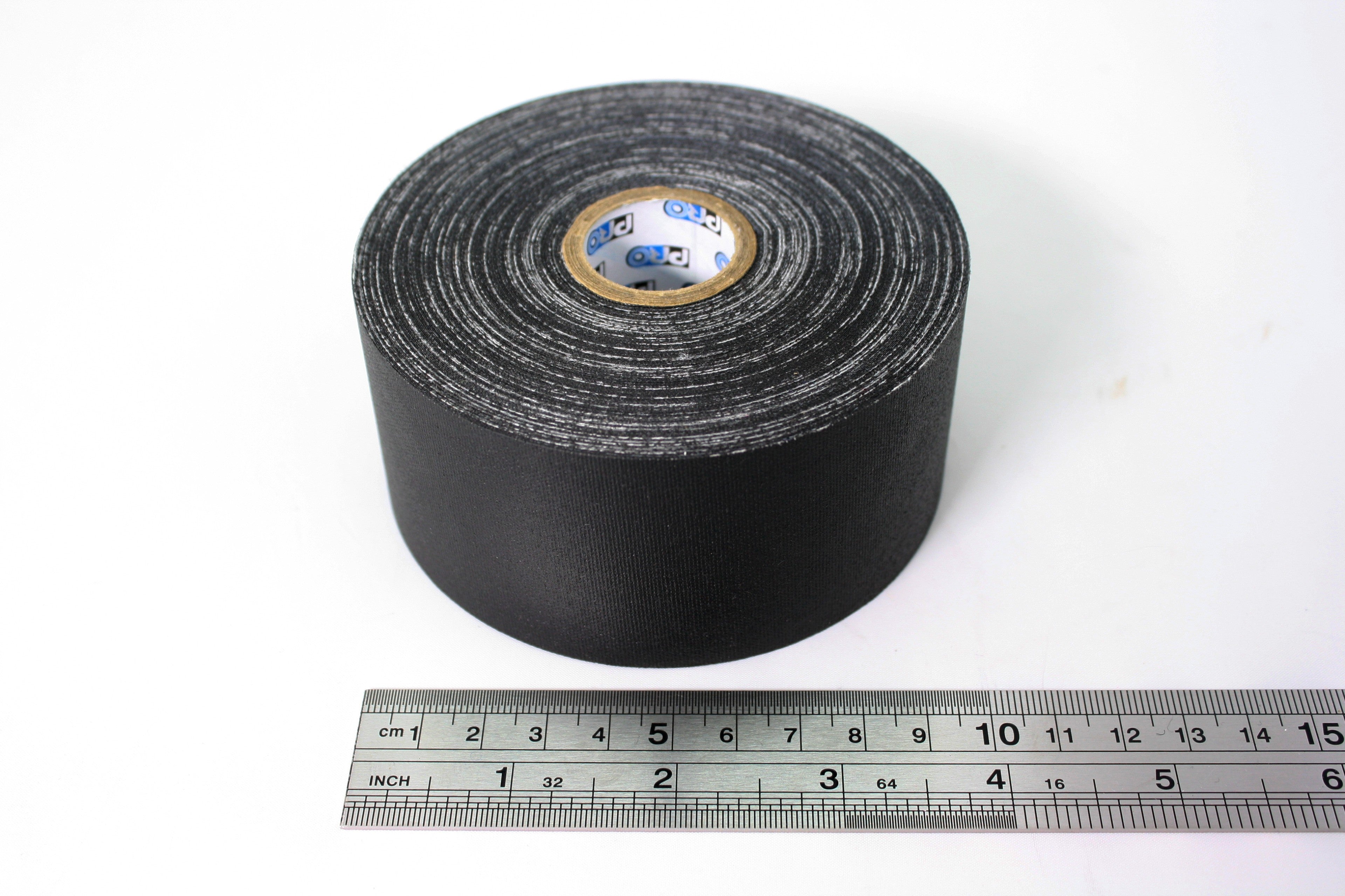 A close up of a 2" roll of Pro Gaff tape, small core, next to a ruler. The image shows that the widest part of the tape roll is just under 10cm