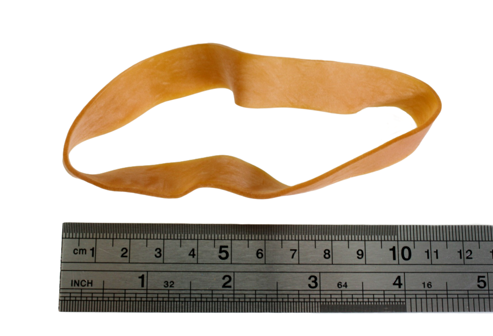 One rubber band next to a metal ruler showing the length to be around 11cm when no tension is applied