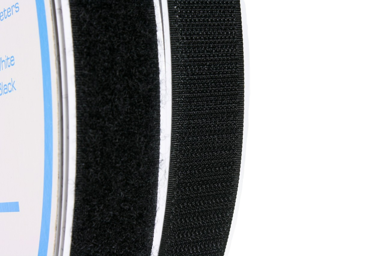 A close up of the 1" black hook and loop tapes, showing the texture of each